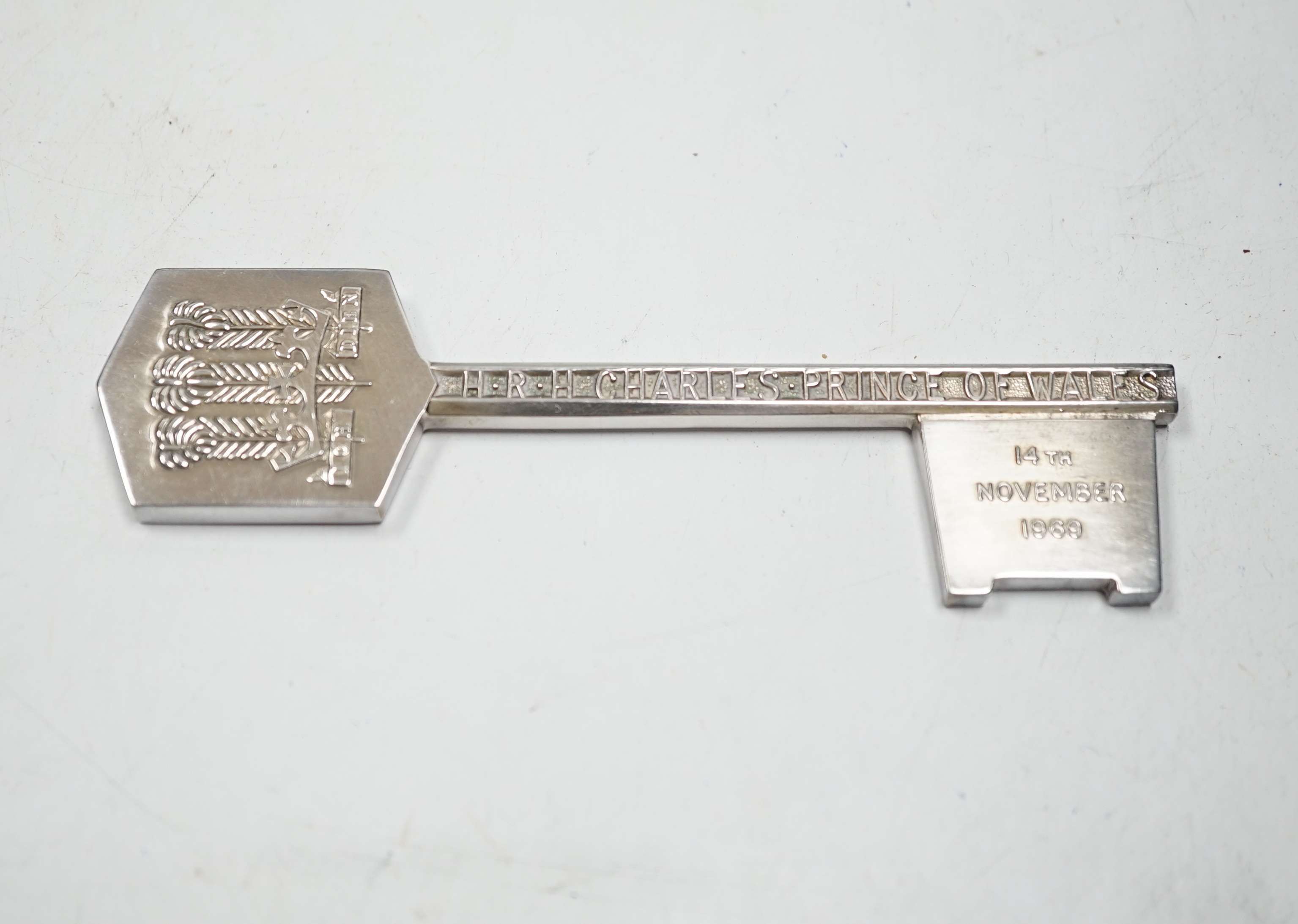 A cased Elizabeth II limited edition 'Prince of Wales Coming of Age' silver presentation key, Turner & Simpson, Birmingham, 1969, no. 27/1000, 12.7cm, 114 grams.